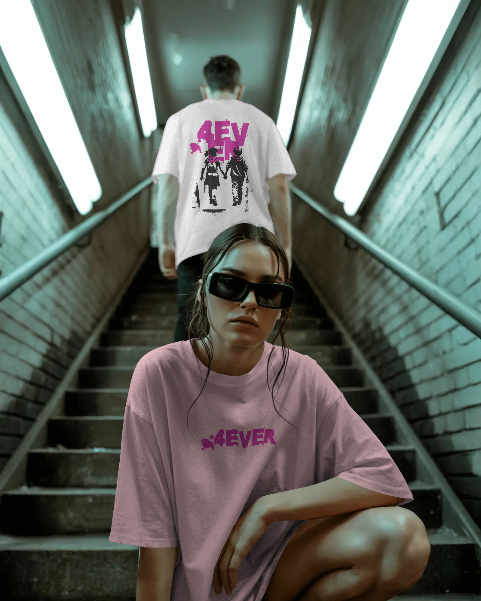 Two people wearing t-shirts with '4ever' text on a staircase.