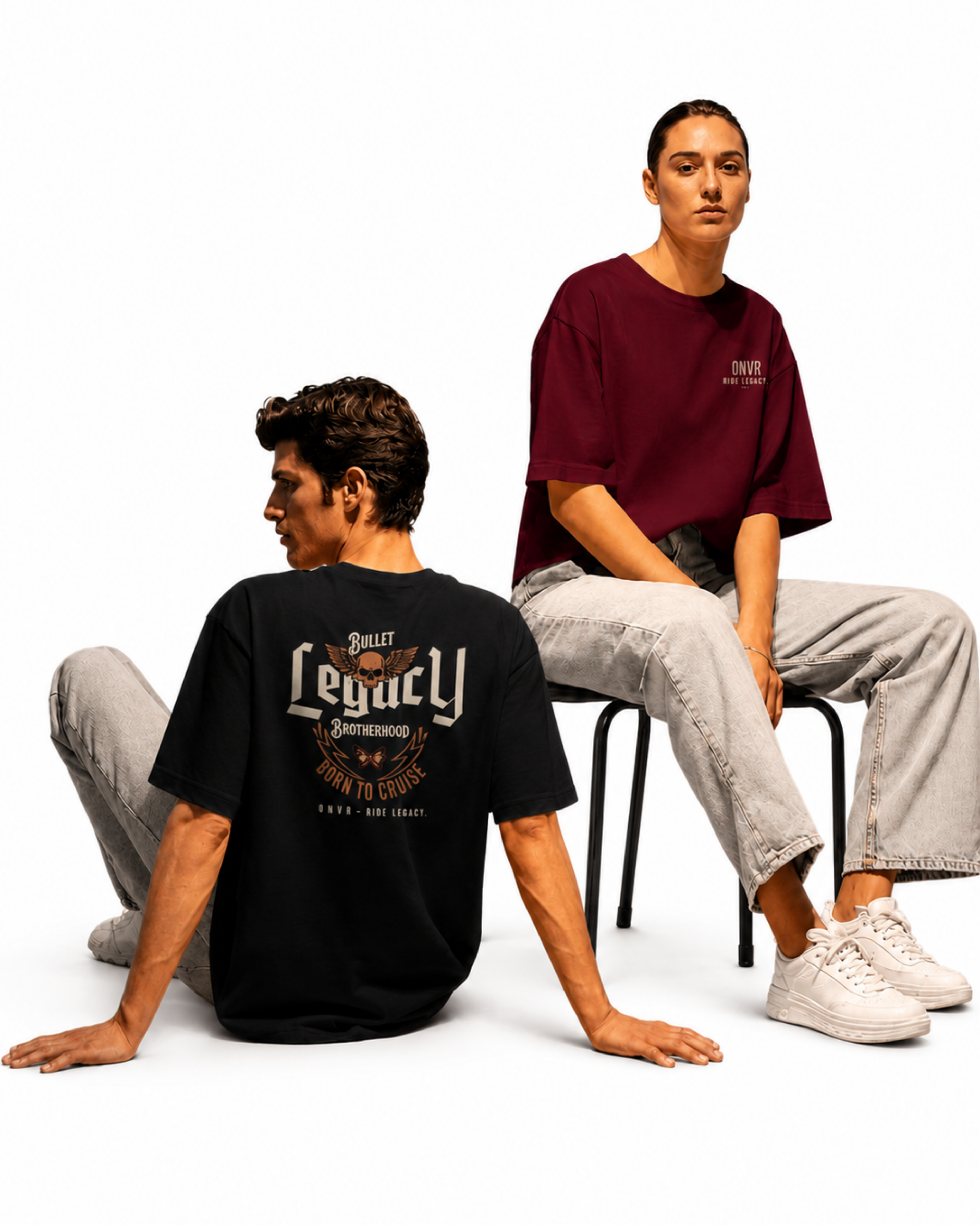 Two people wearing t-shirts with visible branding on a white background