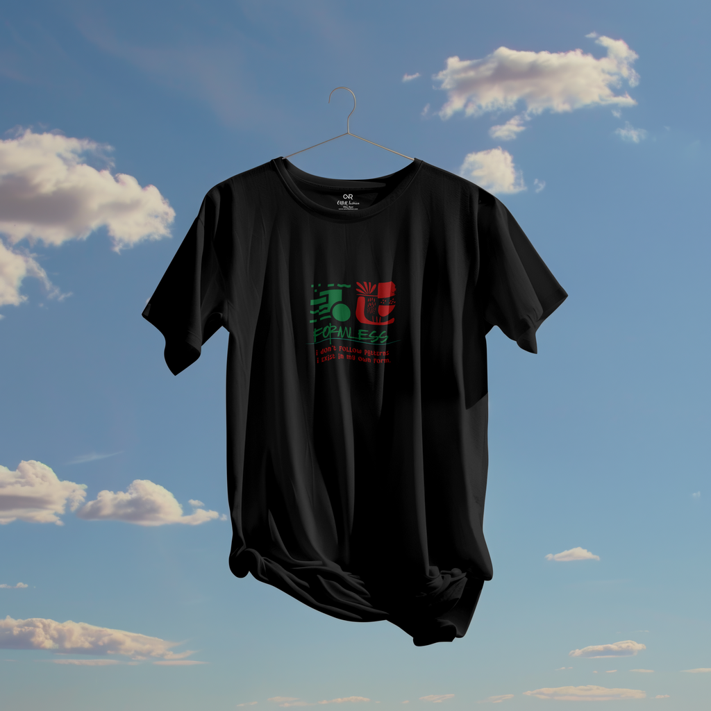 Black t-shirt with colorful design on a hanger against a blue sky with clouds