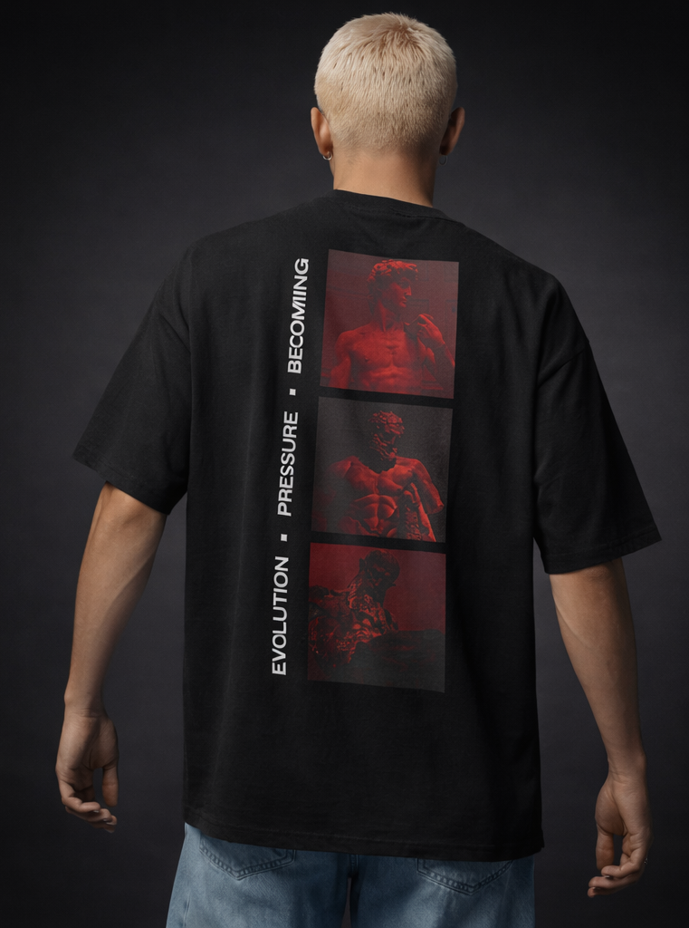 Model wearing a black t-shirt with red graphic design on the back against a dark background