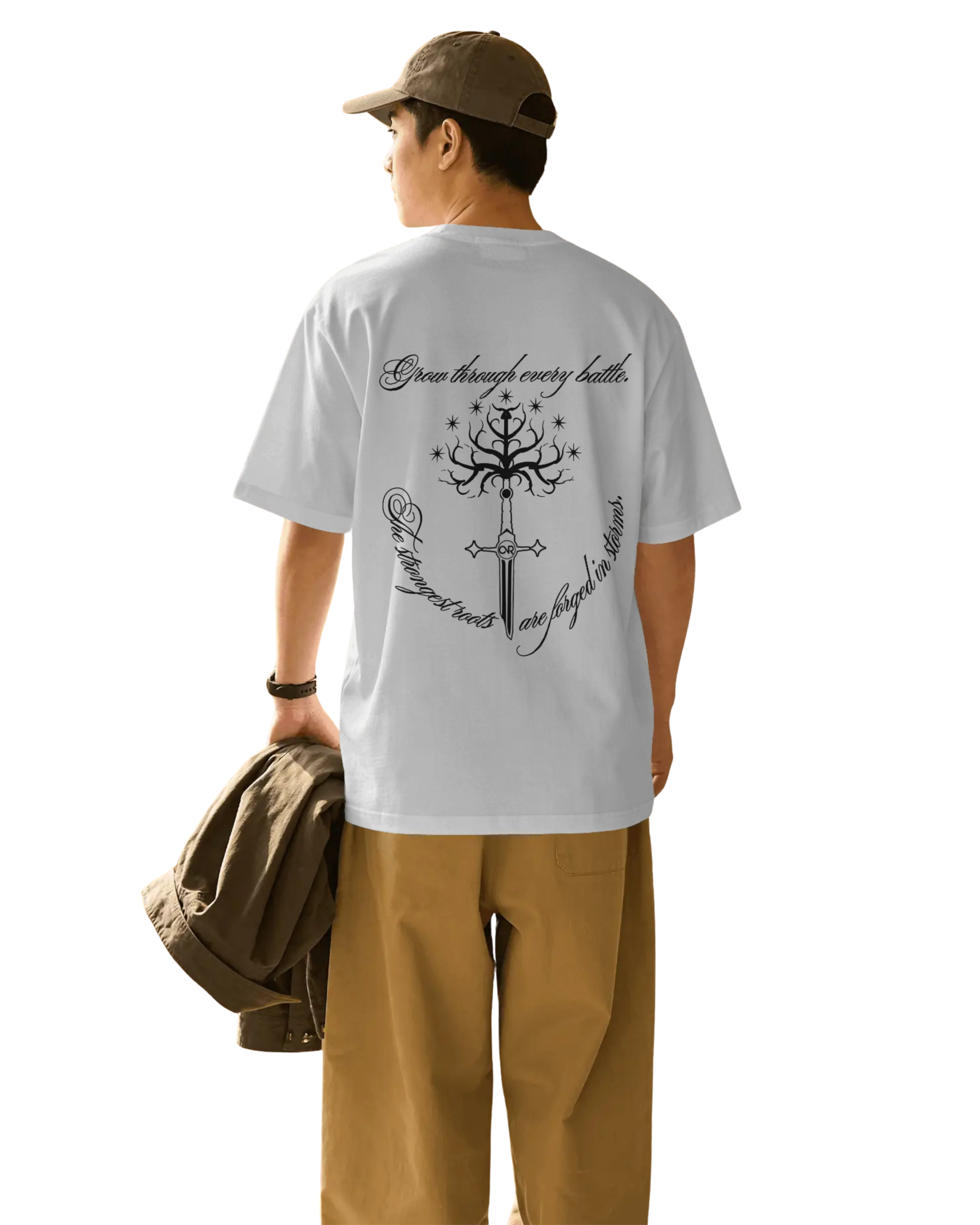 A man wearing ONVR Fashion Oversized t-shirt with the statement graphic and sword on the back of t-shirt
