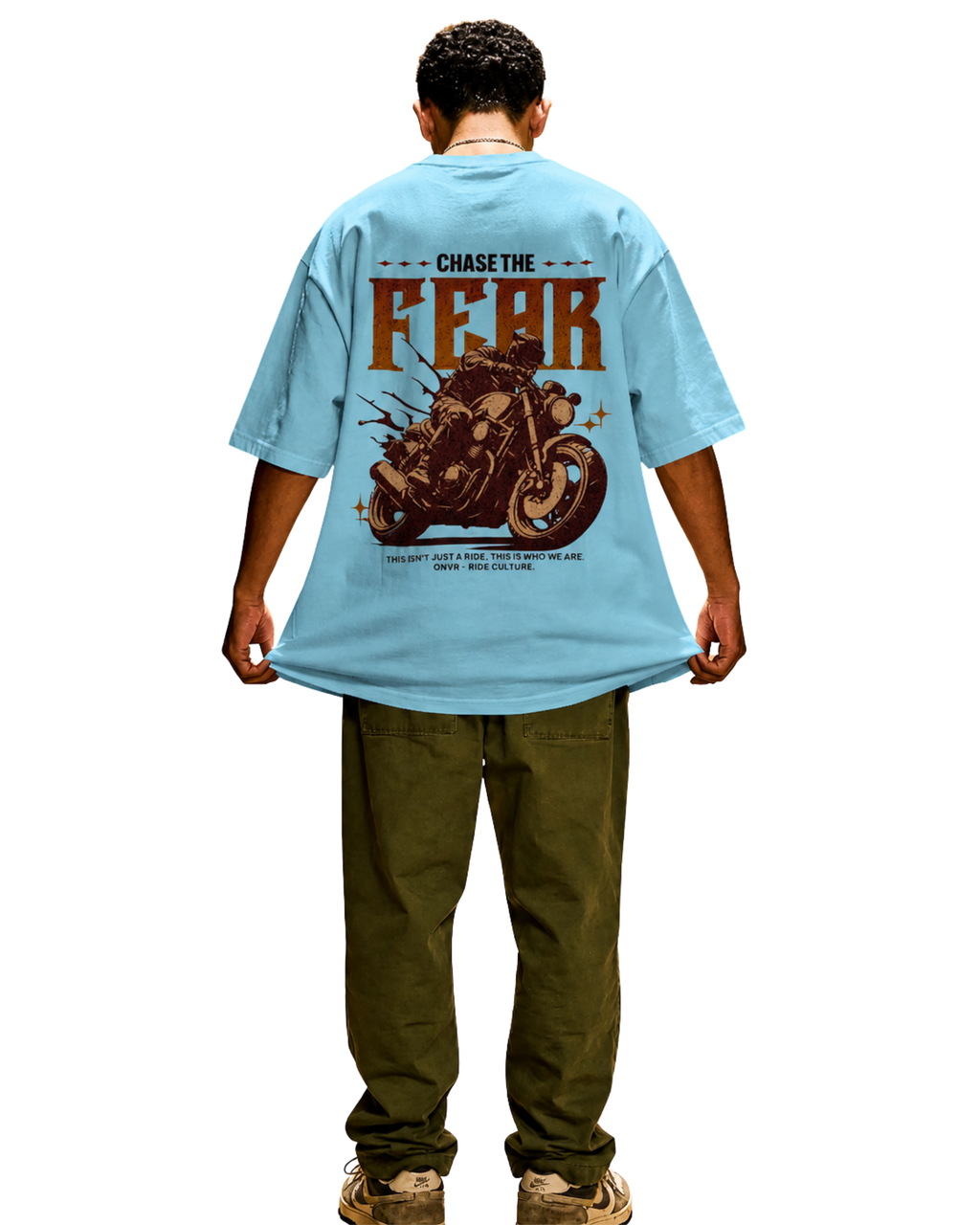 Person wearing a light blue t-shirt with a motorcycle graphic and text on the back.