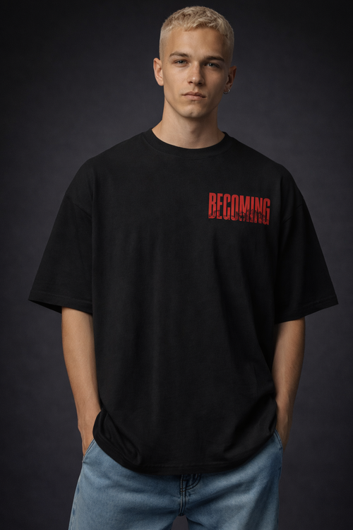 Person wearing a black t-shirt with red text on a dark background