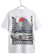 White t-shirt with car graphic and 'demonta' text on a hanger
