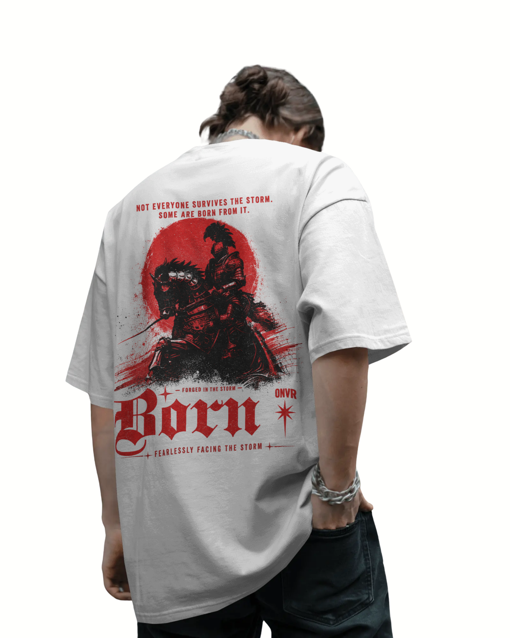 A person shown from the back wearing a light gray oversized ONVR T-shirt with a large red and black graphic print on the back, paired with dark jeans against a plain white background.