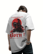 A person shown from the back wearing a light gray oversized ONVR T-shirt with a large red and black graphic print on the back, paired with dark jeans against a plain white background.