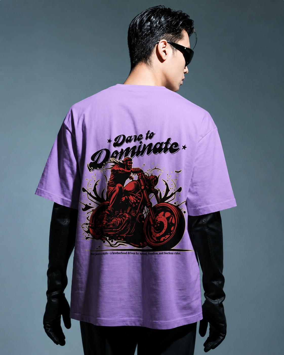 a model standing ovation wearing oversized t-shirt a large graphic design on the back.