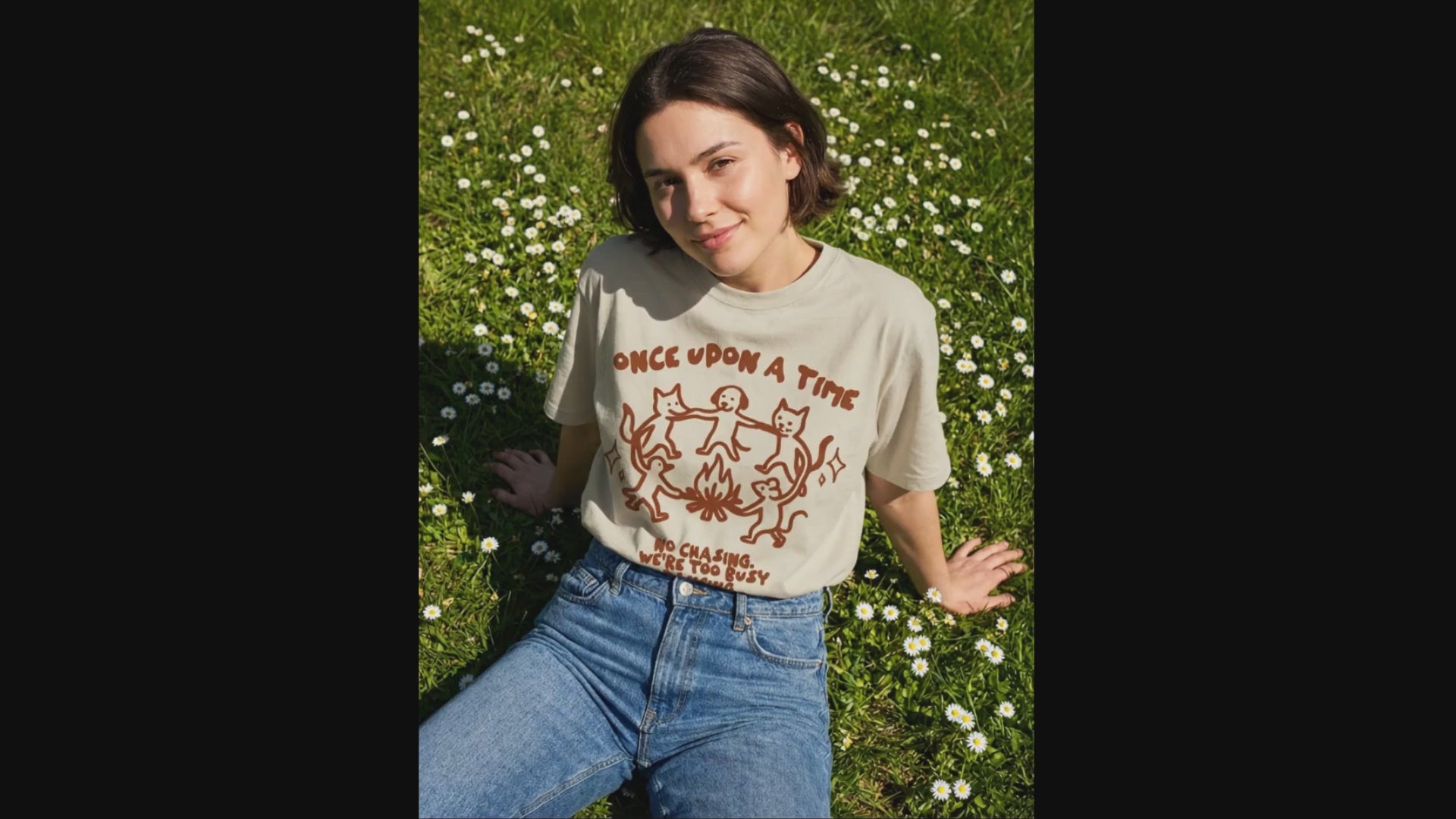 a female model wearing oversized tshirt with a large print design on the front side.